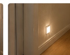 Plug-in night light providing soft light in a hallway